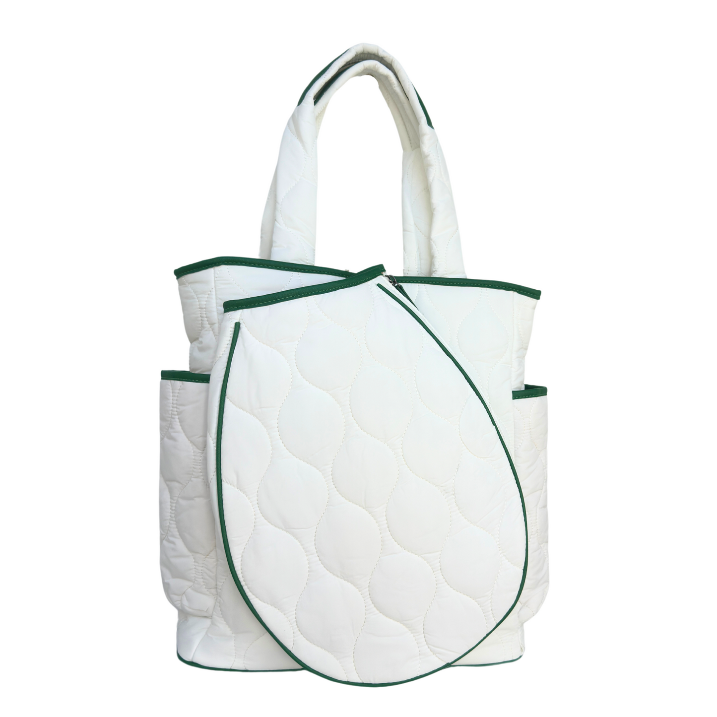 The Queen of the Court Park Ave Tennis Convertible Bag/Backpack is a white quilted tote with dark green accents, two side pockets, padded handles, and comes with a matching accessory pouch. Displayed against a plain white background.
