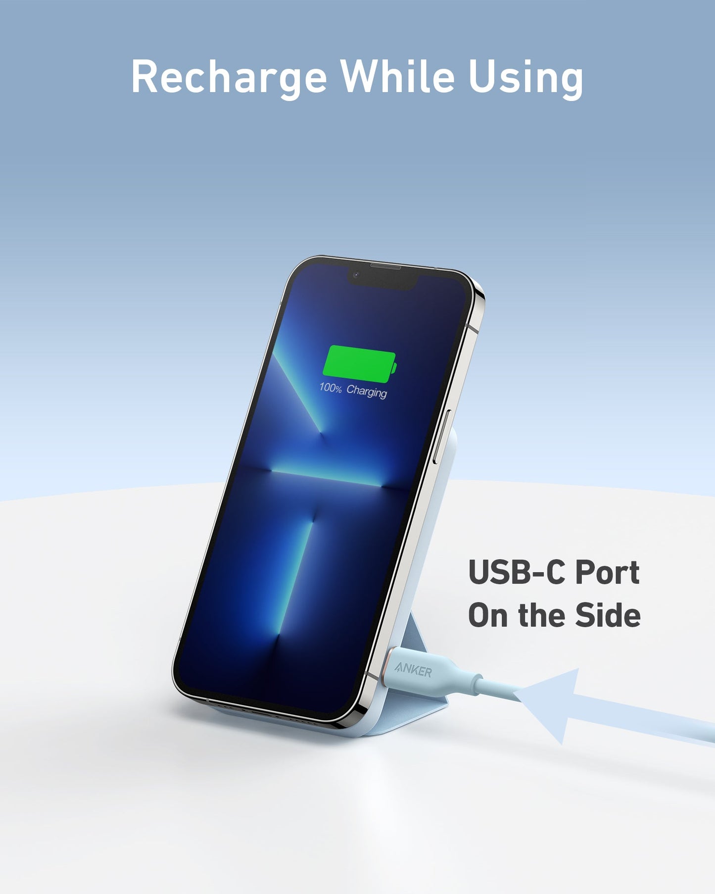 An Anker 622 Magnetic Battery (MagGo) by Anker holds a smartphone upright with a USB-C cable in the side port. The phone displays a green battery icon at 100%. Text on-screen reads, "Recharge While Using" and "USB-C Port On the Side.