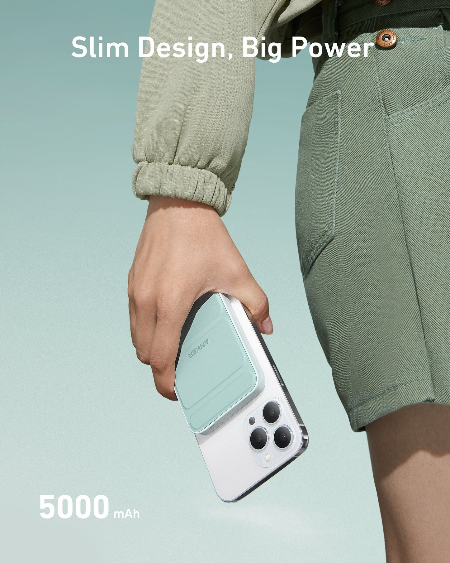A person in green holds an Anker 622 Magnetic Battery (MagGo) by Anker, mint-green and attached to a white smartphone. The soft green gradient background features the text "Slim Design, Big Power" at top and "5000 mAh" at bottom left.