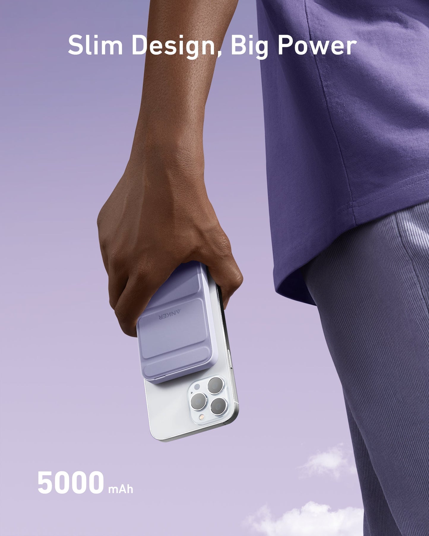 A person in purple holds an iPhone with the Anker 622 Magnetic Battery (MagGo) in lavender, featuring a slim design and foldable kickstand. Against a light purple sky, text reads "Slim Design, Big Power" and "5000 mAh." Brand: Anker.