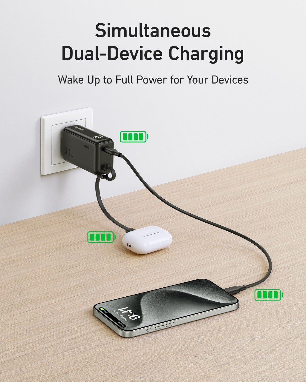 An Anker Power Bank (30W, 5k, Fusion) with a built-in USB-C cable is plugged into a white outlet on a wooden surface, charging a smartphone at 76% and wireless earbuds, both showing active charging.