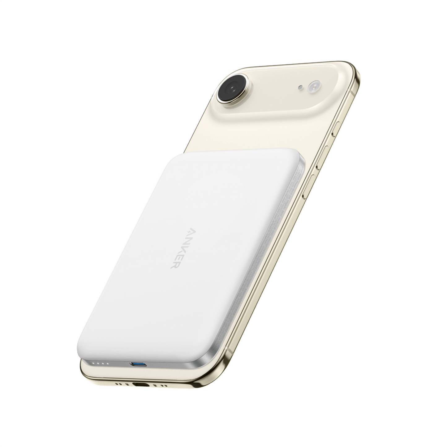 A gold smartphone with a single rear camera has an Anker Nano Power Bank (5K, MagGo, Slim) in white attached to its back. The slim charger features a subtle Anker logo, 20W USB-C charging, LED indicator lights, and a plain white background.