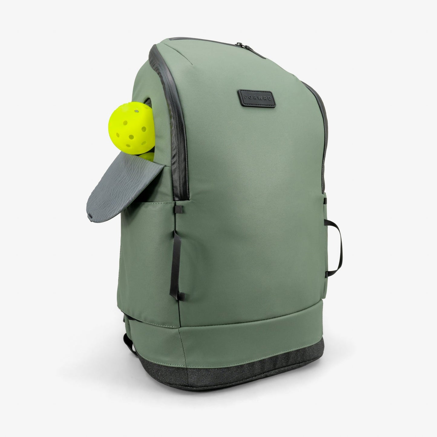 The FORWRD Court Caddy Pickleball Bag in sage green features black zippers, a gray bottom, and a side pocket holding a gray paddle and bright yellow pickleball, all shown upright against a white background.