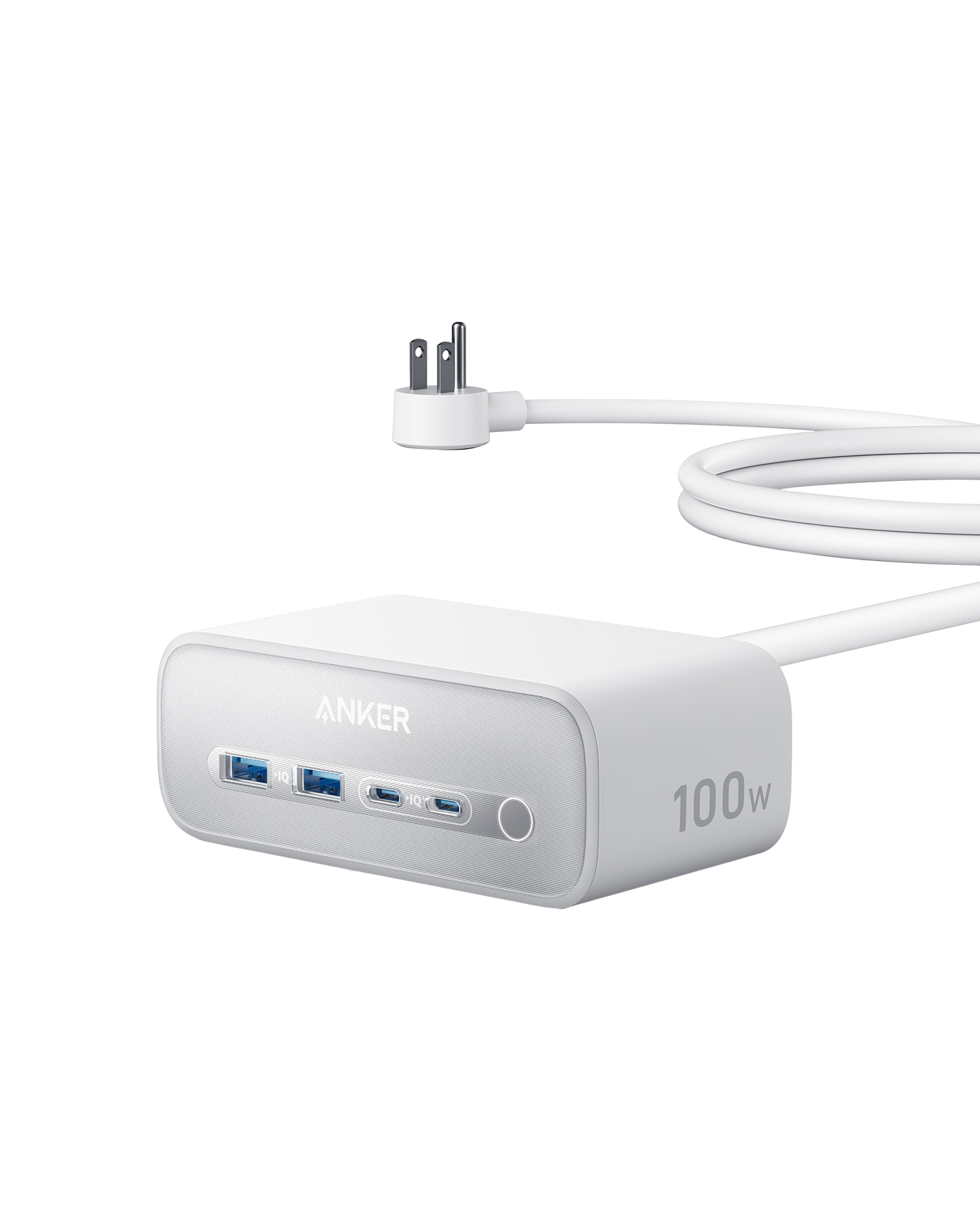 The Anker Charging Station (7-in-1, 100W) is a white, rectangular device with rounded edges featuring two USB-C ports, two USB-A ports, a long white cable with foldable prongs, and ANKER 100W branding on its surface.