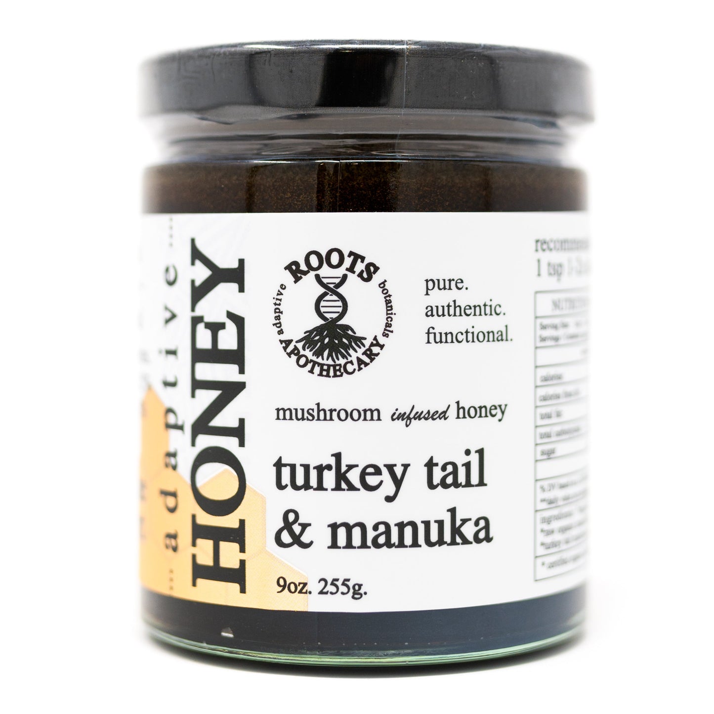 A 9oz (255g) glass jar of Roots Apothecary turkey tail honey (mushroom), raw manuka honey infused with turkey tail mushroom extract, featuring a black lid and a white label with bold black details.