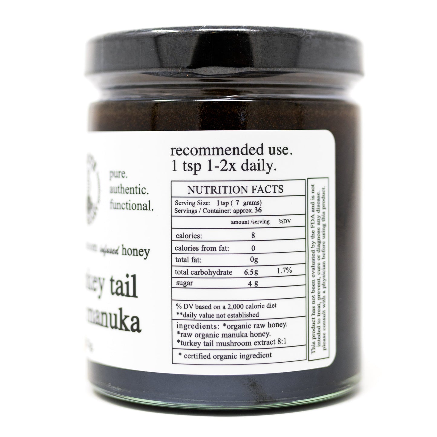 Roots Apothecary turkey tail honey (mushroom) comes in a glass jar with a black lid. The label lists nutrition facts, use (1 tsp 1–2x daily), and organic ingredients: raw manuka honey and turkey tail mushroom extract 8:1.