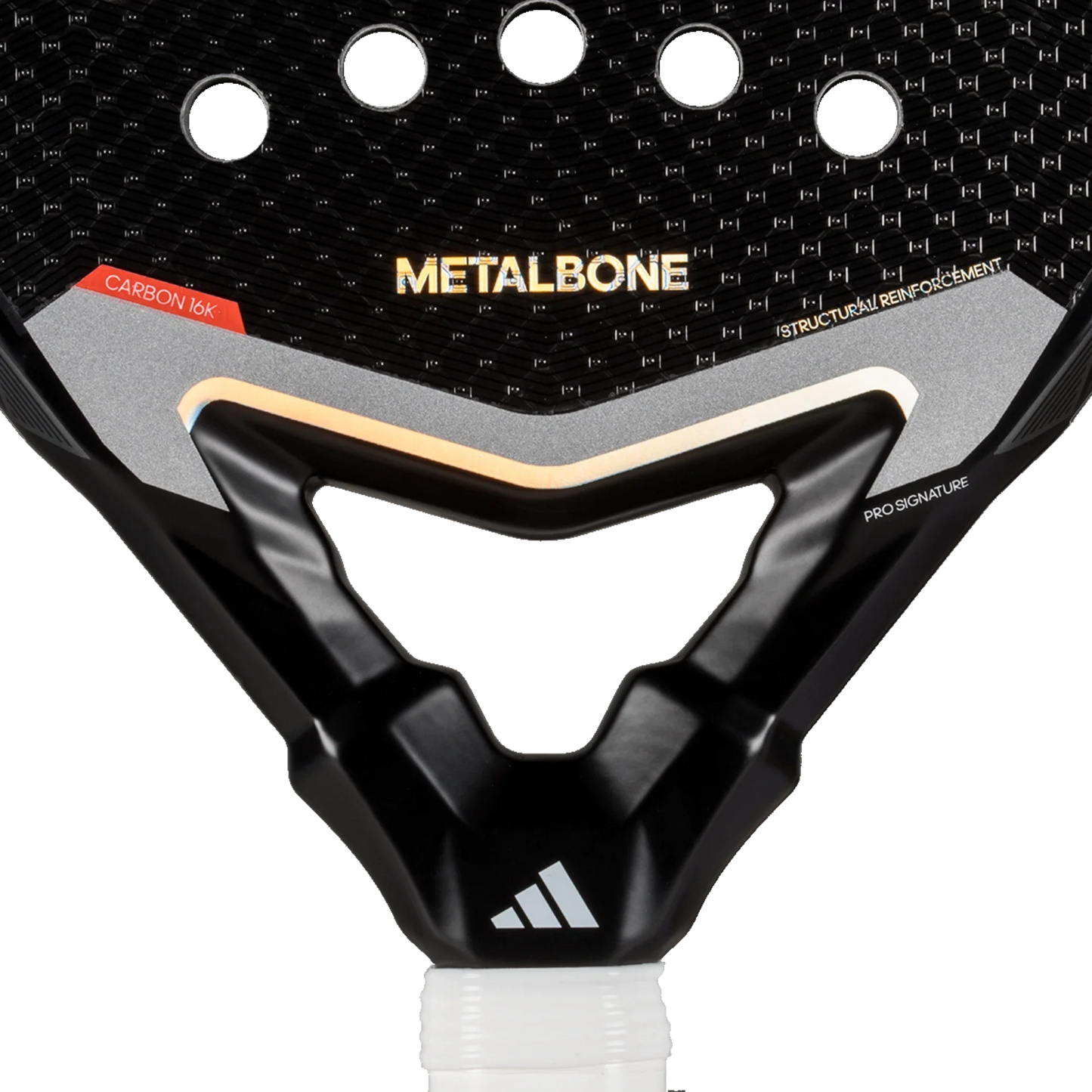 Close-up of the Adidas Metalbone 3.4 paddle face by Padel USA, featuring “METALBONE” in gold, circular holes, angular designs, and “CARBON 16K”/“PRO SIGNATURE”—a professional racket built for power and control.