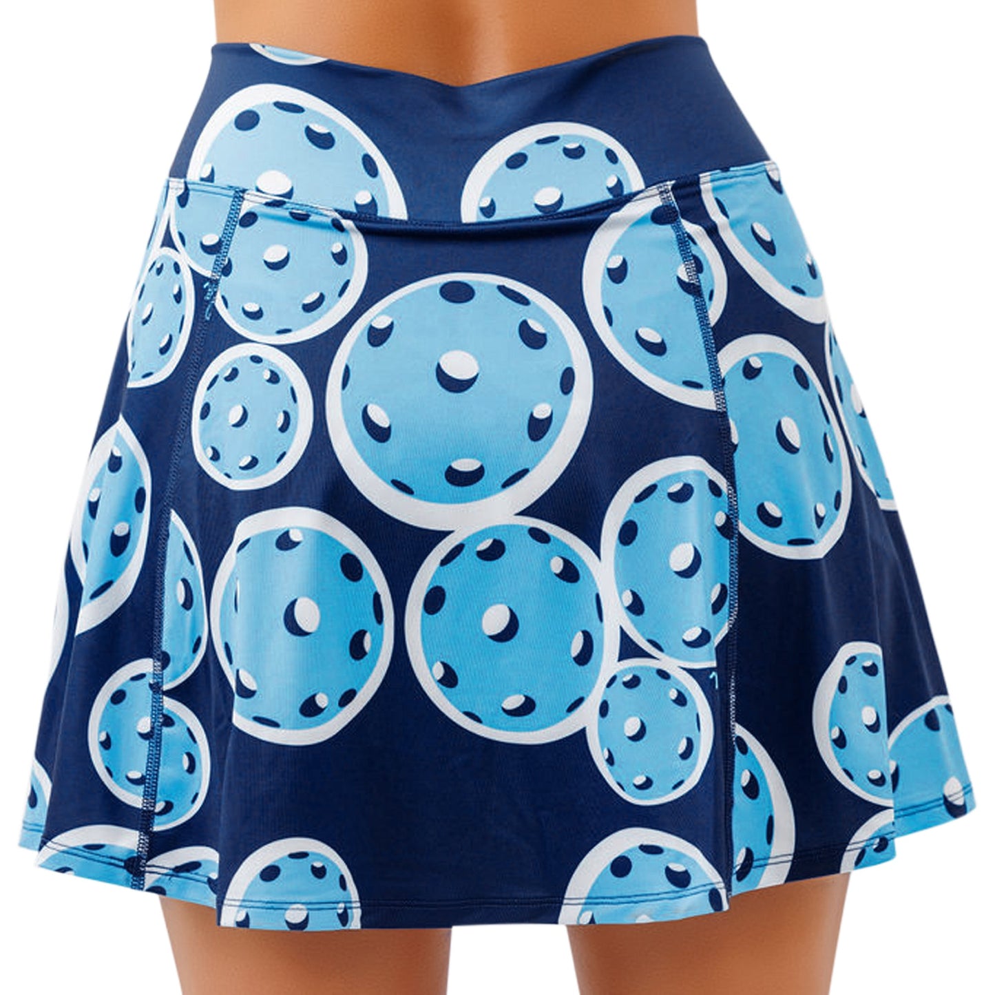 The Pickleball Bella PB Aline Skort Double Bounce is a navy blue flared skirt featuring light blue pickleball patterns with white dots and dark blue shading, visible seams, and comfortable 4-way stretch fabric.