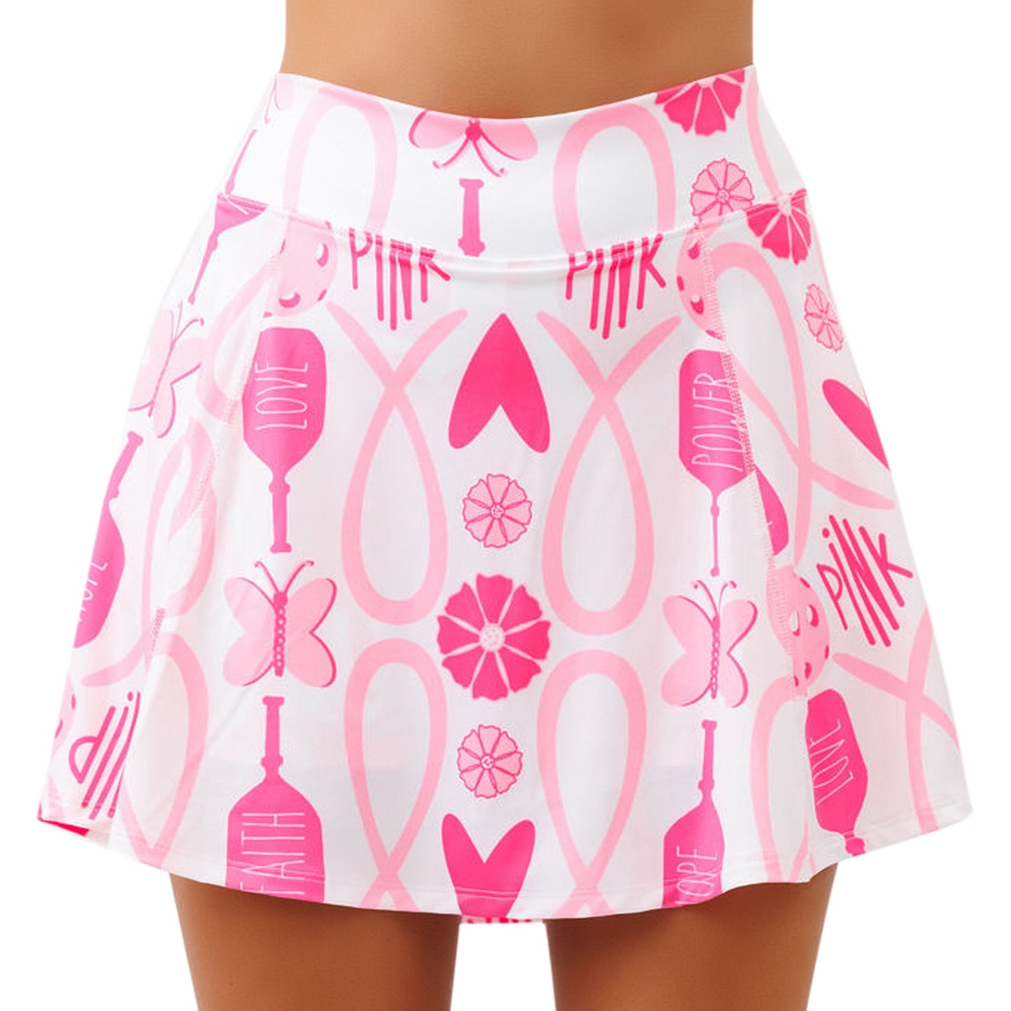 A woman models the Pickleball Bella PB Aline Skort Hope, featuring a pink butterfly, heart, and inspiring word print—ideal for breast cancer awareness. The flared skort sits above the knees.