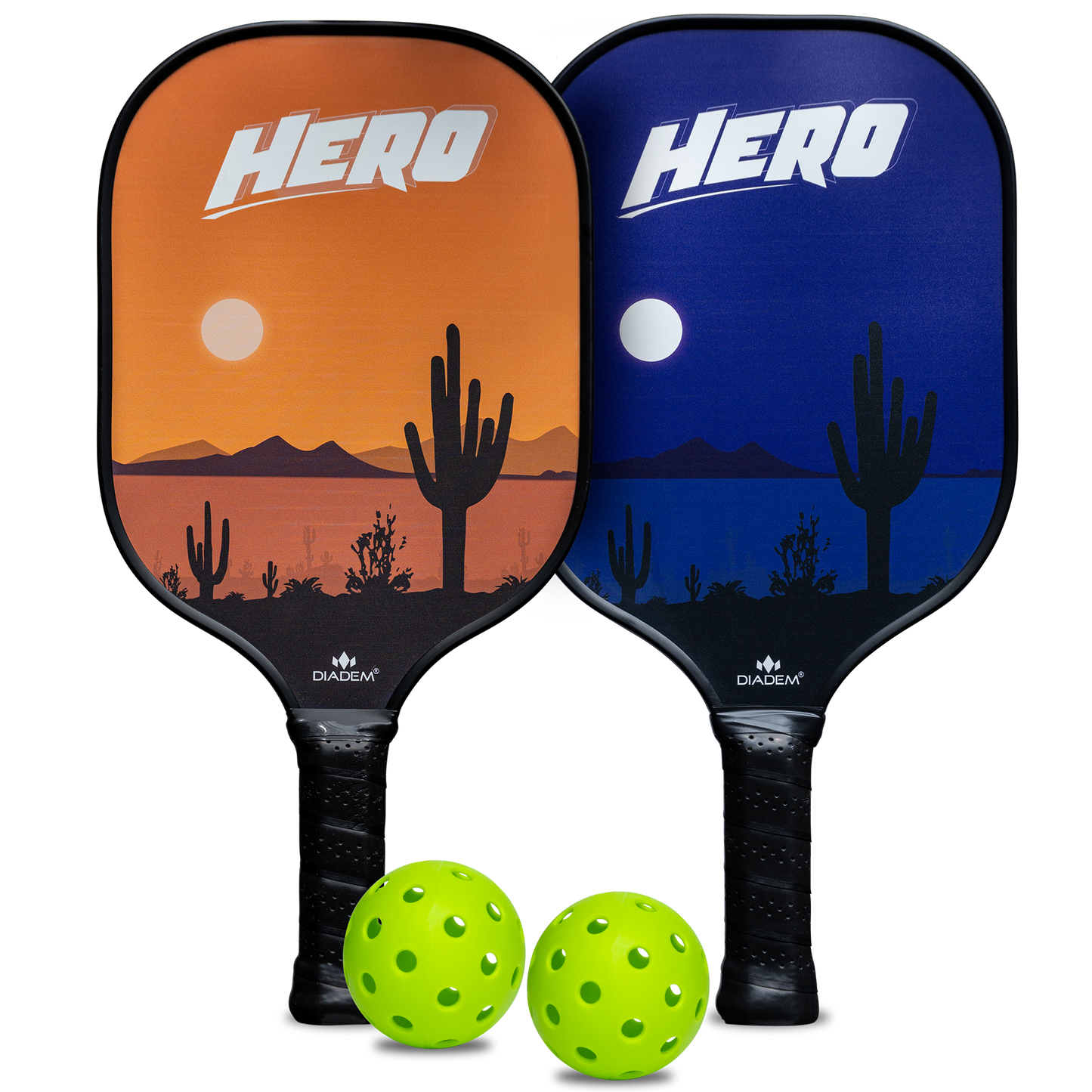The Diadem Sports Diadem Hero Starter Kit includes two pickleball paddles—one with an orange sunset and one with a blue night cactus design, both labeled “HERO”—and two bright green pickleballs, ideal for beginners.