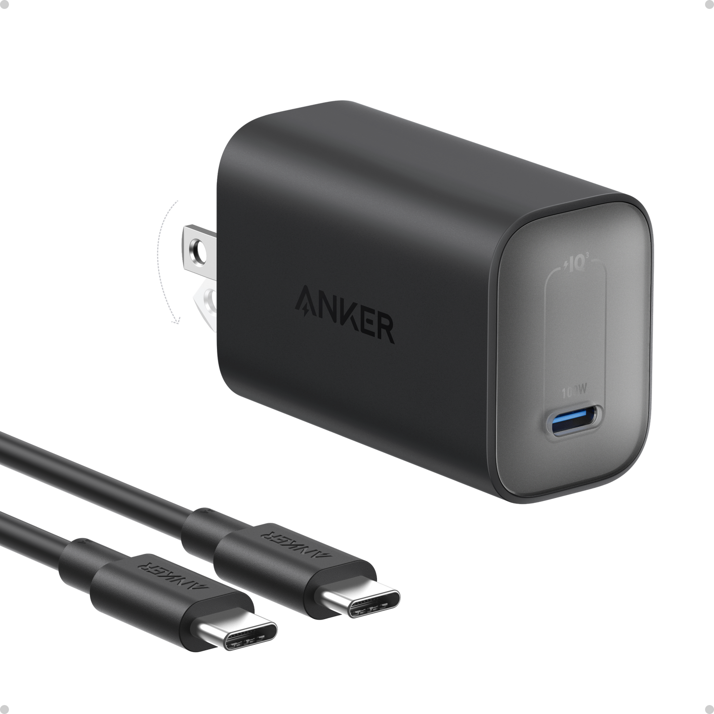 A black Anker Nano Charger (100W) wall charger with a single USB-C port and folding prongs sits next to two black USB-C to USB-C cables on a white background. The charger features the Anker logo in gray lettering.