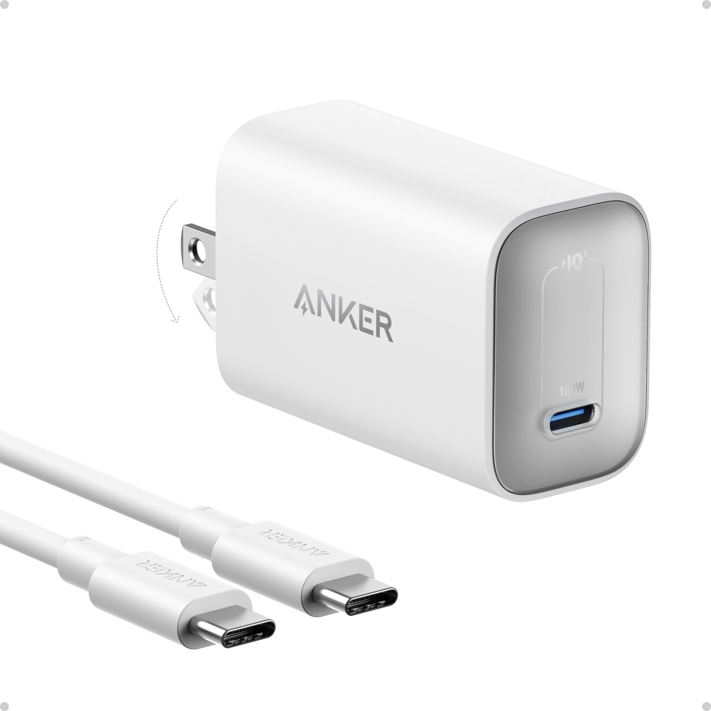 An Anker Nano Charger (100W) with a foldable plug and blue USB-C port is shown at an angle, accompanied by two white USB-C to USB-C cables, highlighting Anker's compact design and subtle branding.