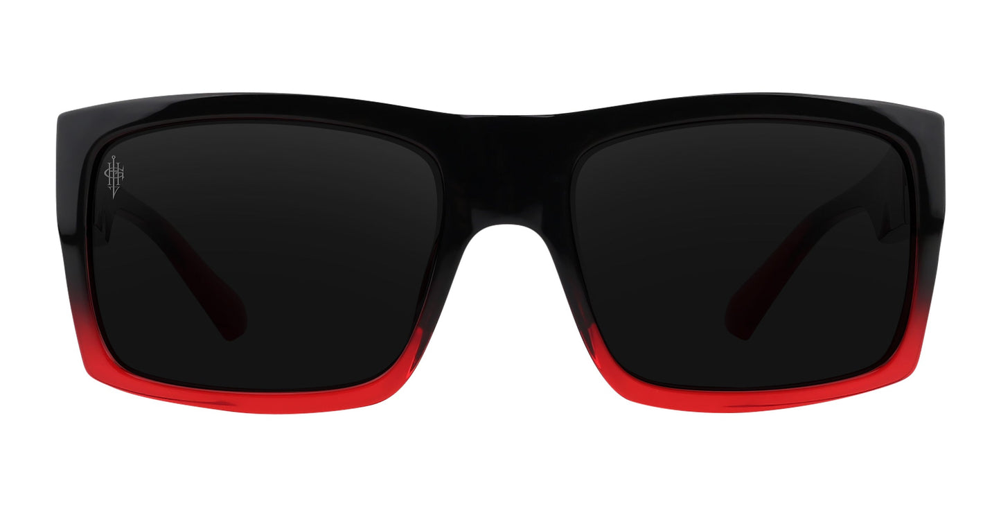 The Blood Fade by Neven Eyewear features rectangular polarized sunglasses with thick, glossy black tops and bright red bottoms. Large, dark-tinted lenses deliver a bold, Gary Holt-inspired style shown against a white background.
