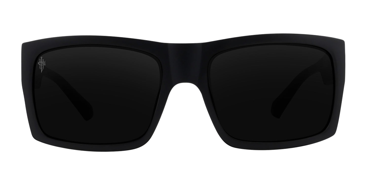 The Neven Eyewear Redrum sunglasses feature a matte black, rectangular oversized design with thick frames and dark polarized lenses. A subtle logo appears on the top corner of the left lens. Shown against a white background.