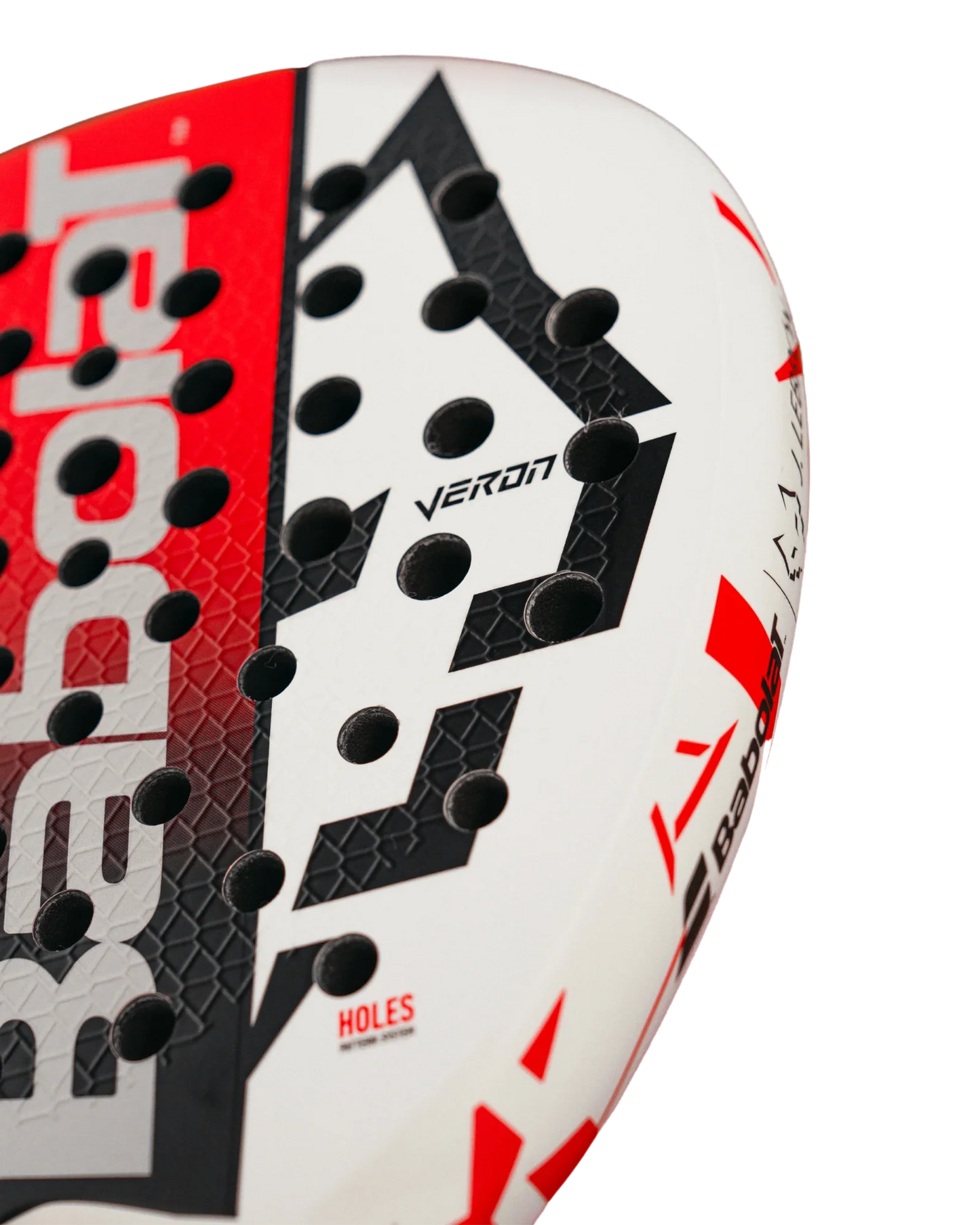 Close-up of a white and red Babolat Technical Veron Juan Lebron 2.5 padel racket from Padel USA, featuring black geometric patterns, circular holes, and VERON in black—designed for advanced players. The brand is partially visible on the side.