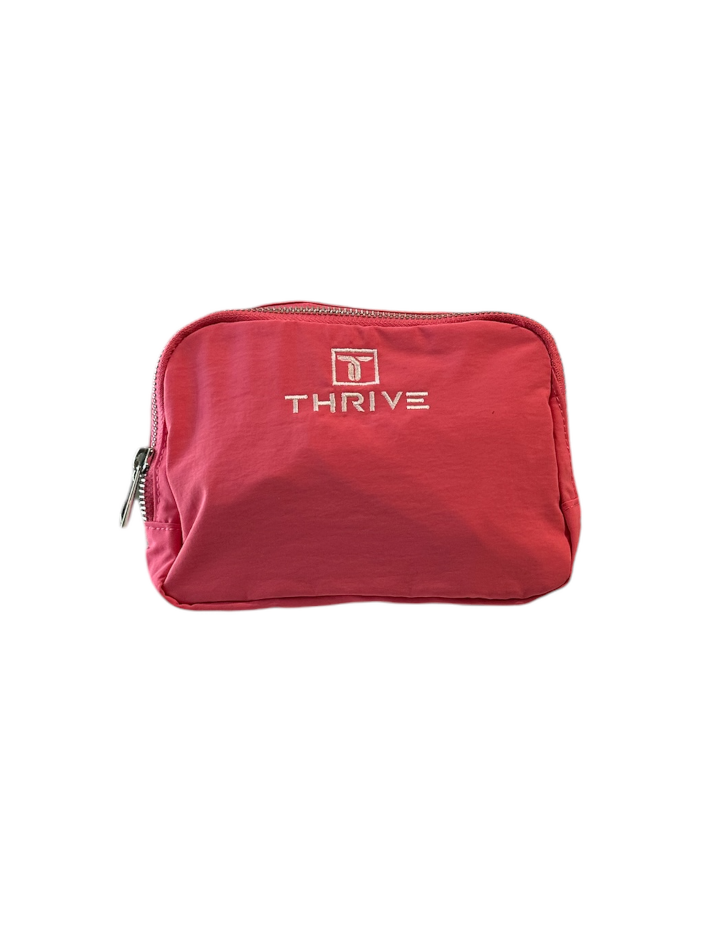 The Thrive Pickleball Belt Bag is a small rectangular pink pouch with "THRIVE" and a white logo embroidered on the front. It features a silver top zipper and is shown against a white background, perfect for organized travel.