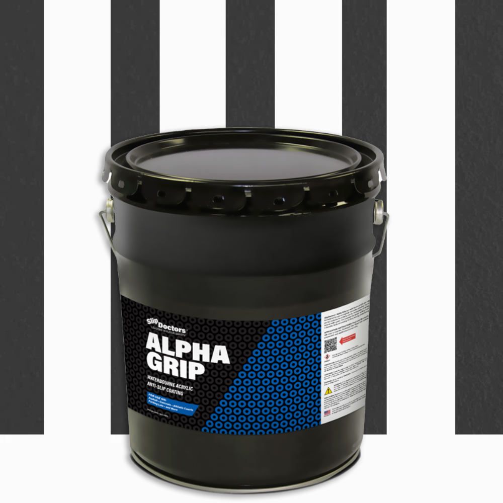 A large black bucket of SlipDoctors Alpha Grip Non-Slip Stripe and Athletic Court Paint with a handle and a detailed blue-and-white label sits on a surface with bold black and white stripes.