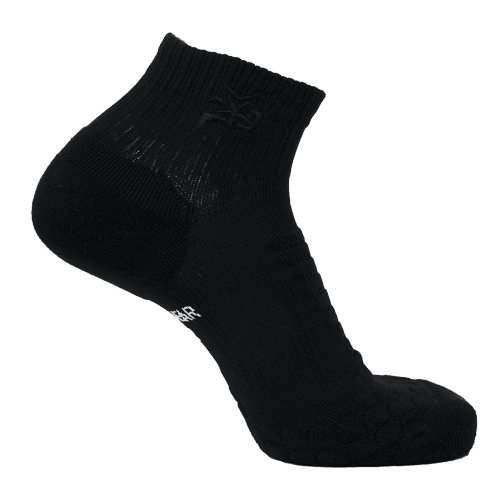 The iReliev AMP Ankle Compression Sock in black is displayed on a white background. This moisture-wicking sock features a ribbed cuff, subtle texture, a small embroidered logo by the ankle, and reinforced heel and toe for durability.
