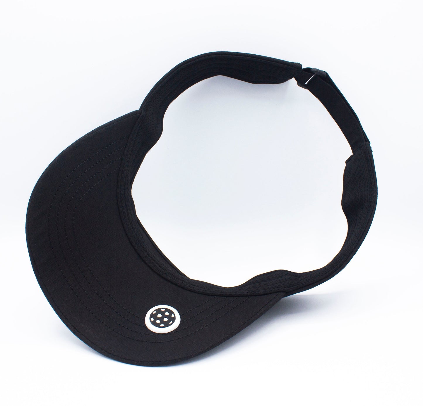 The Bodhi Performance ICON Visor is black with an open top, curved brim, and a small round white logo with black dots at the center front. Its sleek design is perfect for pickleball.