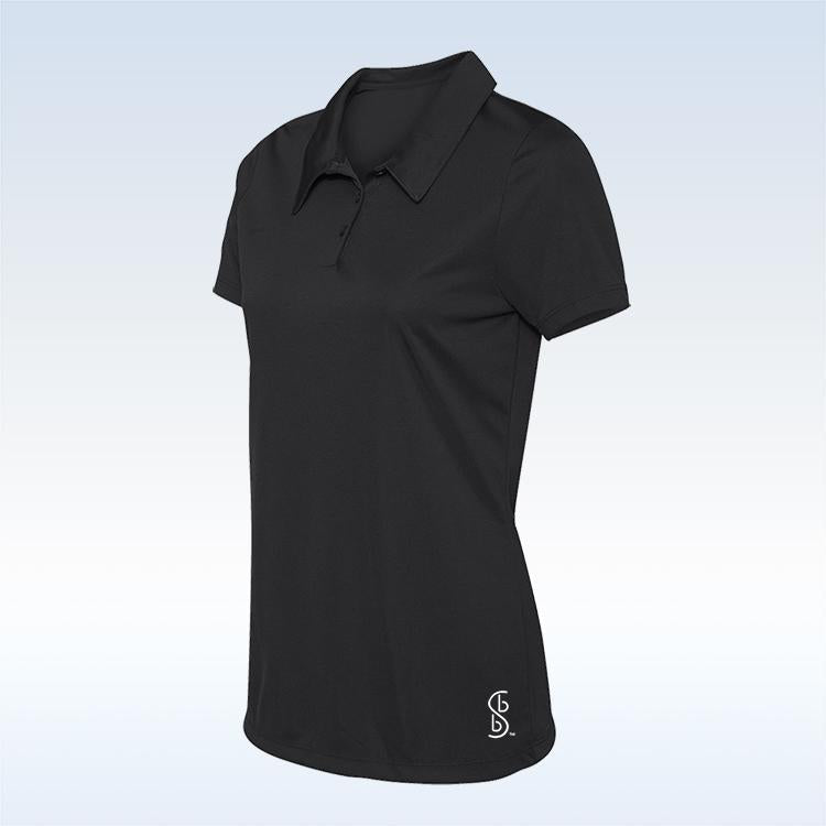 The Pickleball Bella Graffiti 2 Straight Golf Skort is shown on a white-to-light-blue gradient background, paired with a short-sleeve black polo featuring a collar, three buttons, and a small white "SB" logo by the left hem.
