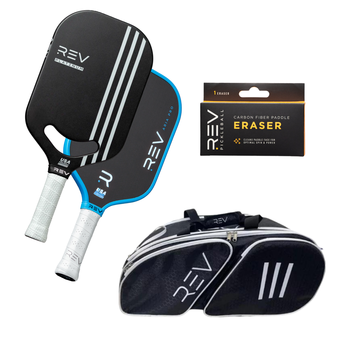 The Professional - Mix & Match - Bundle for 2 by REV Pickleball features two black paddles with white and blue accents, a REV Pickleball bag with white logo and stripes, and a carbon fiber paddle eraser in yellow and black packaging.