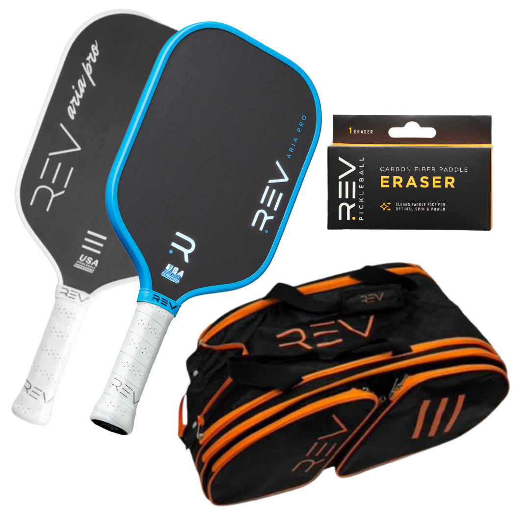 The REV Pickleball Professional - Mix & Match - Bundle for 2 includes two black paddles with blue and white trim, a black paddle eraser in a box, and a black duffel bag with orange accents, all displayed on a white background.