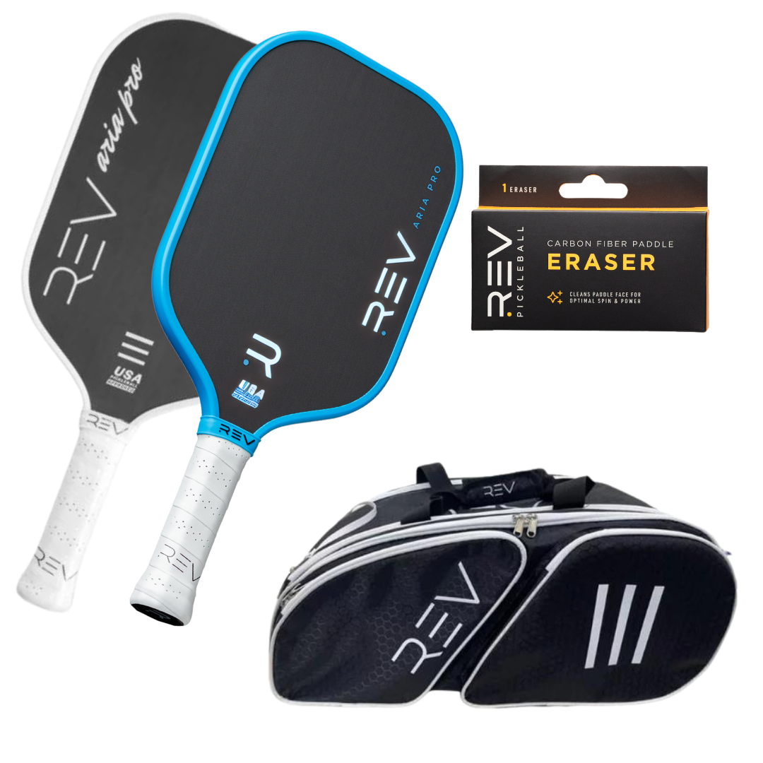 The Professional - Mix & Match - Bundle for 2 from REV Pickleball includes two black carbon fiber paddles with white grips and blue trim, a black-and-white paddle bag, and a carbon fiber paddle eraser. The paddles feature “Aria Pro” and “USA.”.