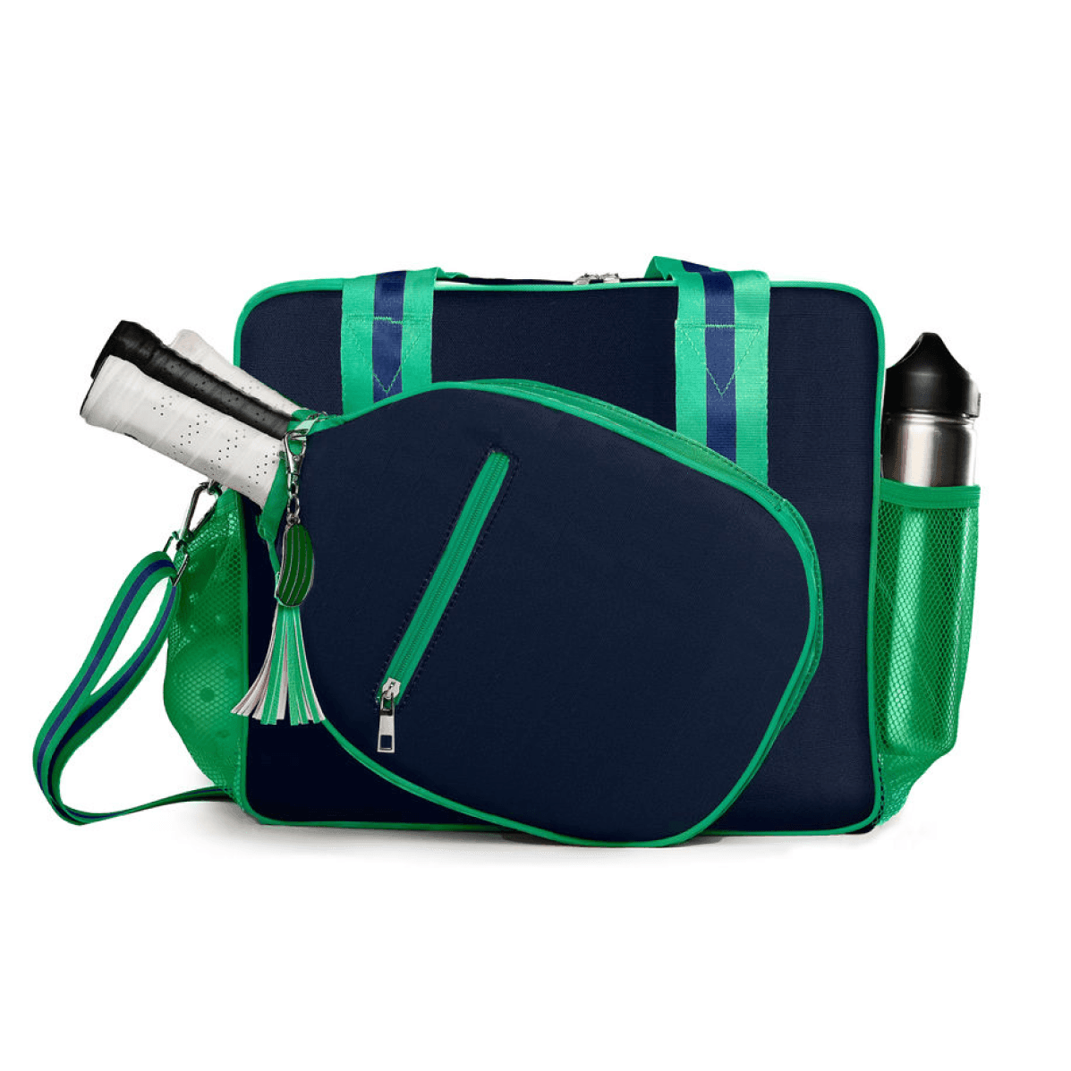 The Fresh Pickle Lola Pickleball Tote Bag features navy blue and green colors, a roomy main compartment, diagonal zip pocket for two racquets, green handles and strap, plus a mesh side pocket that fits a silver water bottle.