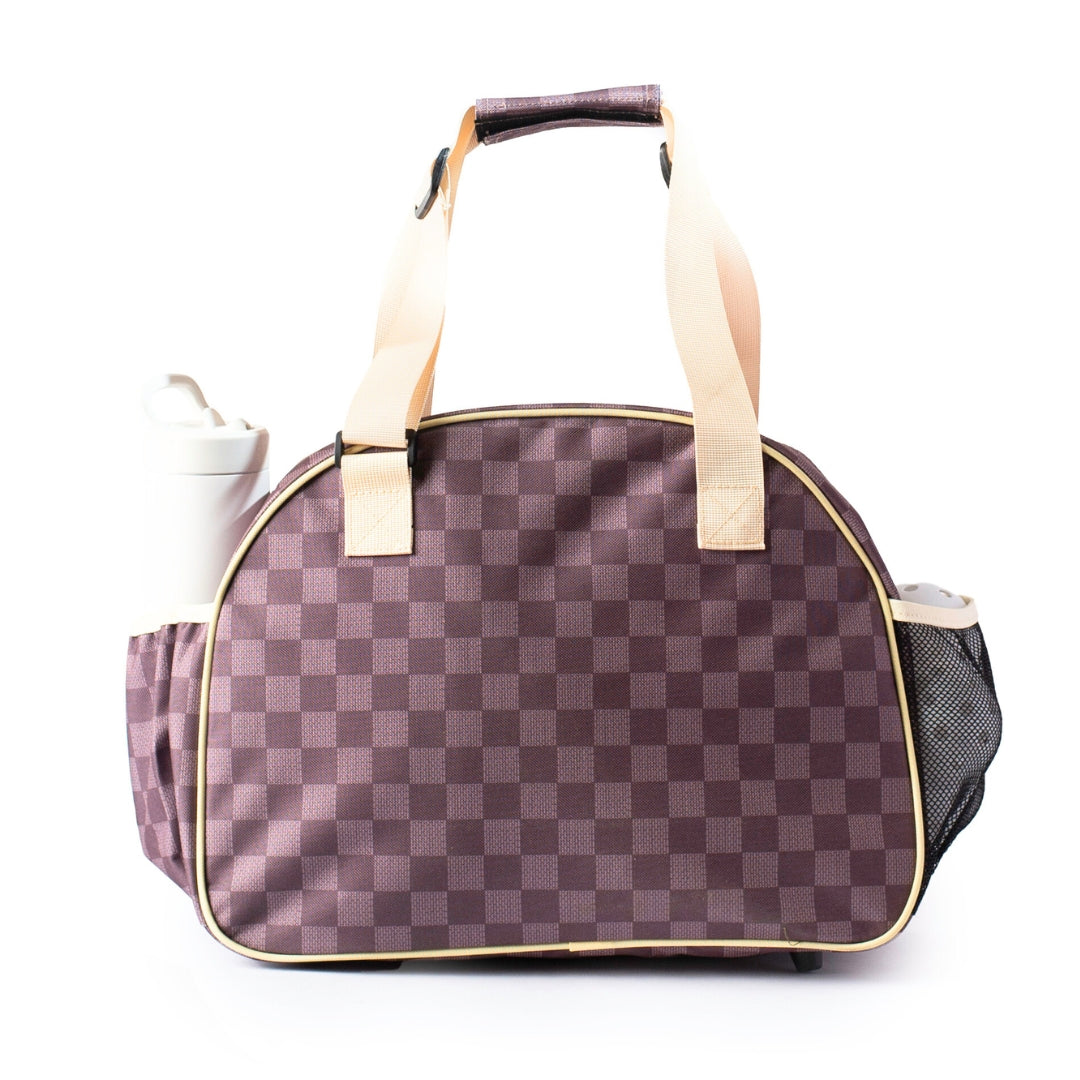 The Checkered Chic Brown Premium Women's Pickleball Bag by Pik'le'Ball Sports has beige handles, a left pocket with a white bottle, and a black mesh right pocket. Displayed on a white background.