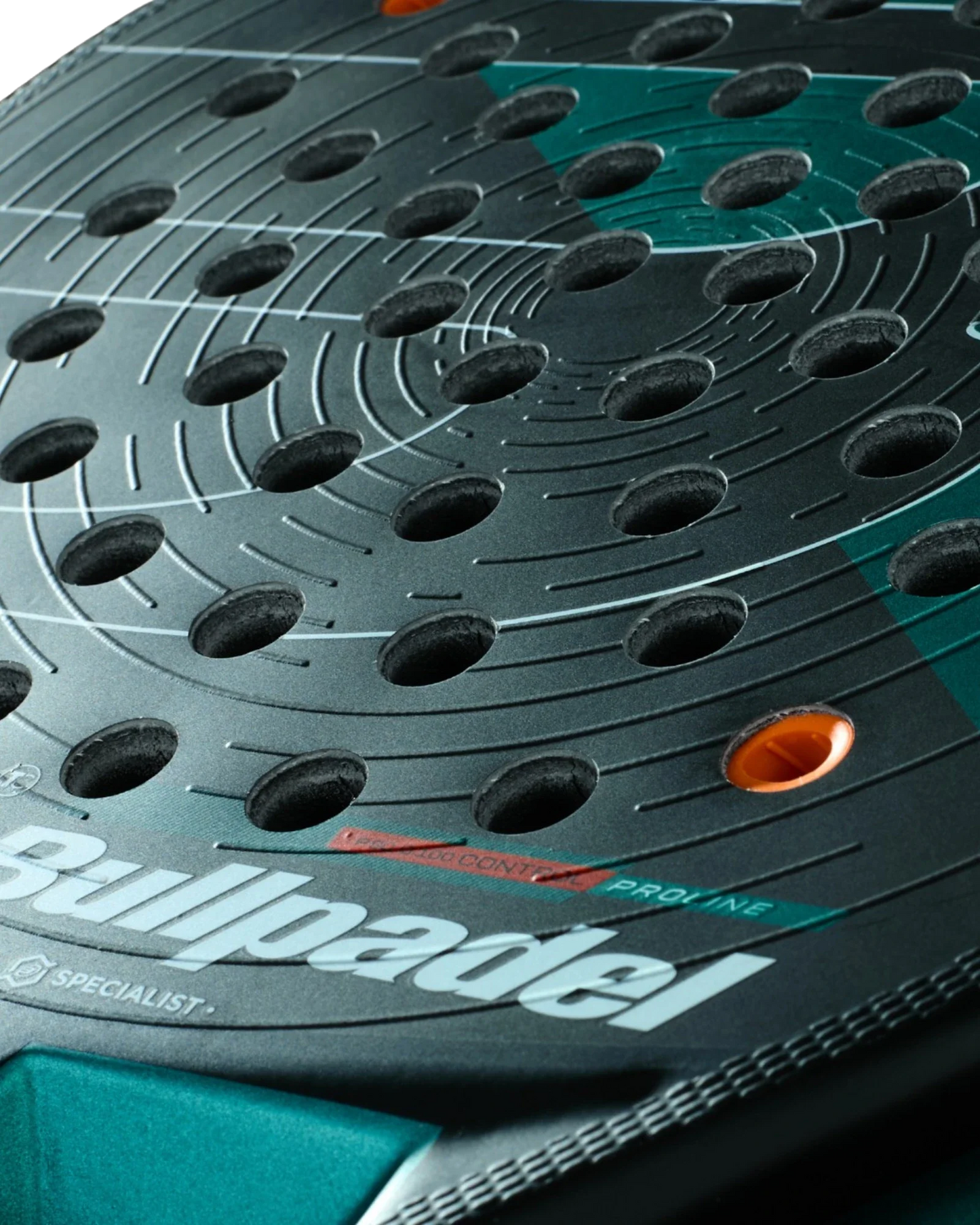 Close-up of the Bullpadel Hack 04 Hybrid padel racket from Padel USA, highlighting circular perforations, textured lines, orange accents, and a white Bullpadel logo on a teal and black face.