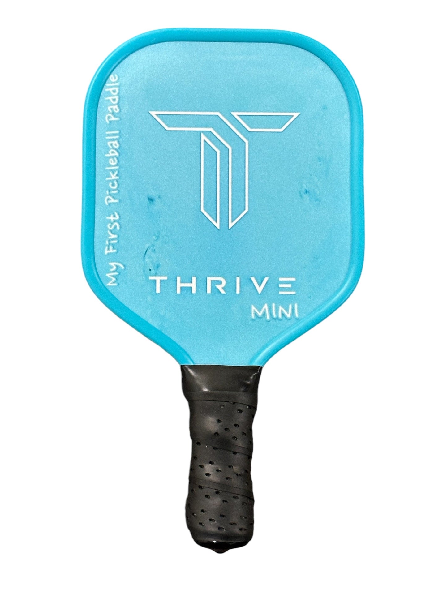 The Thrive Mini Baby Paddle by Thrive Pickleball is a small blue paddle featuring "THRIVE MINI" and a white geometric logo, black grip tape, and "My First Pickleball Paddle" along the left edge—an ideal newborn keepsake or unique baby gift.