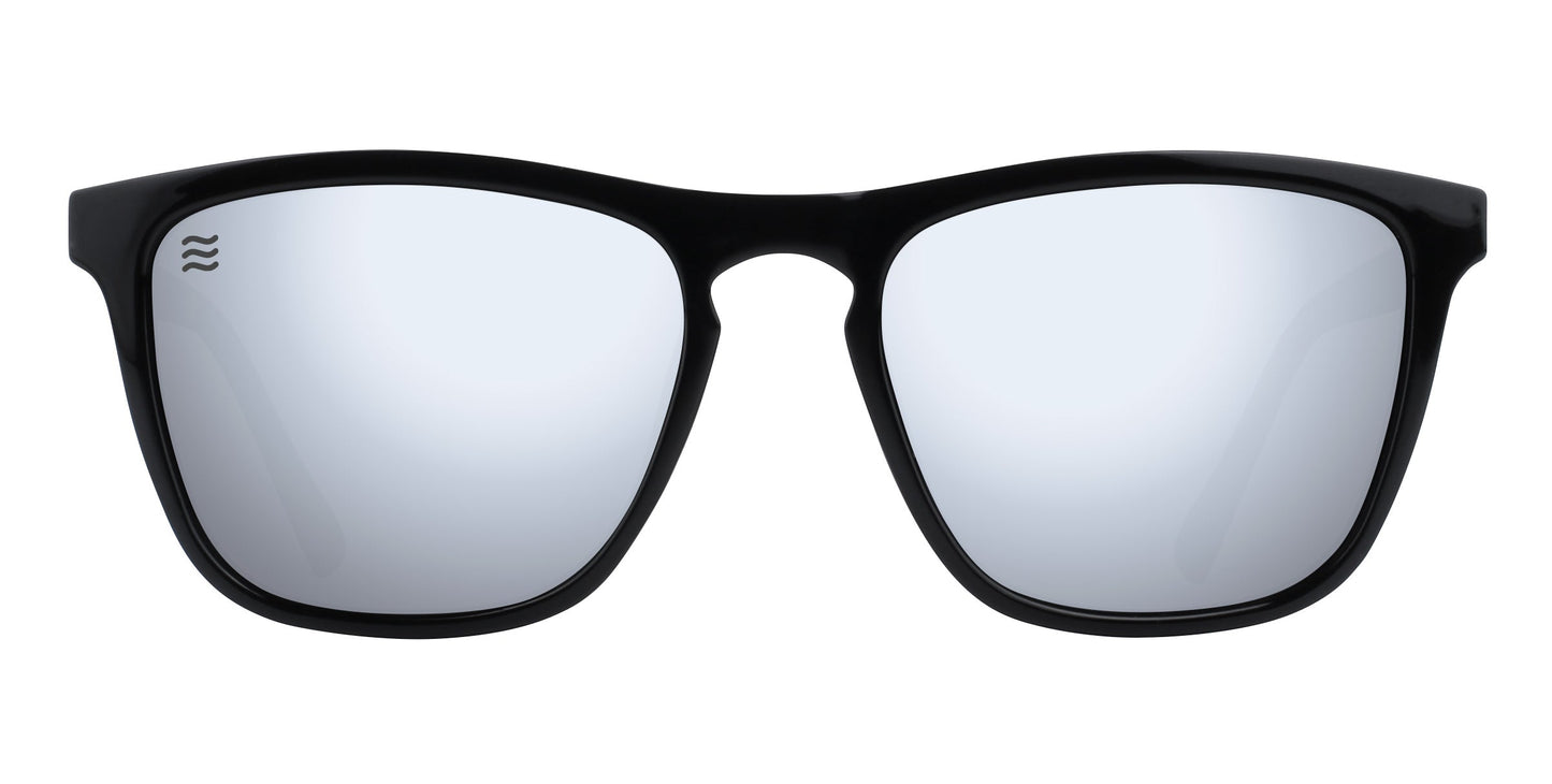 A pair of Neven Eyewear Canova sunglasses from the Cambridge Collection, with thick glossy black frames, large mirrored rectangle lenses, and a small white wavy logo on the top left corner of the left lens. Plain white background.