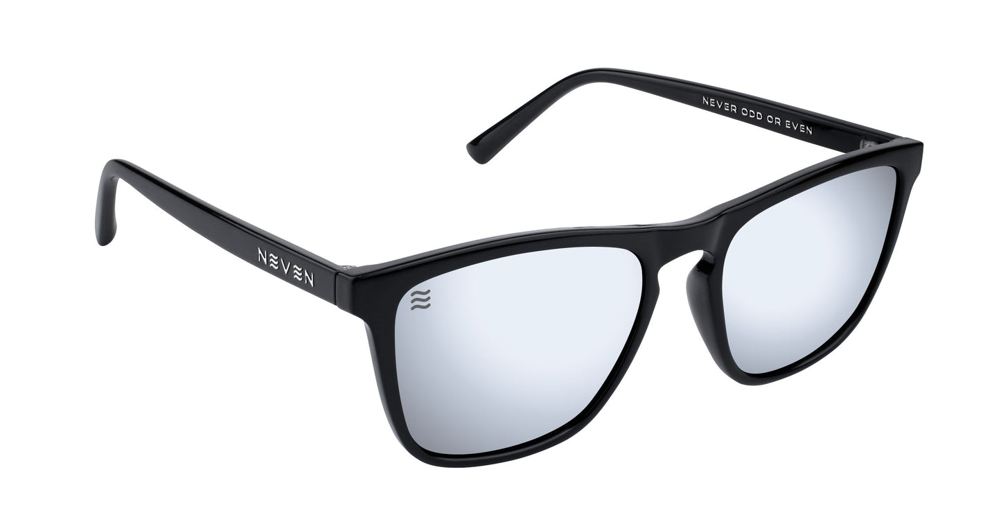 A pair of black rectangle Canova sunglasses by Neven Eyewear with silver mirrored lenses. The left arm displays NEVEN in white, and the inner right arm features "NEVER COAST. CR. NEVEN." Part of the modern Cambridge collection.