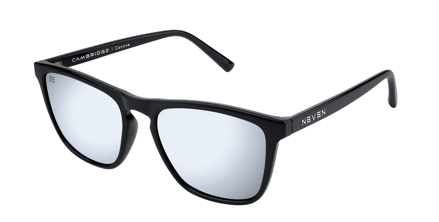 Canova sunglasses by Neven Eyewear feature a matte black rectangle frame with mirrored lenses showing a subtle blue tint. "CAMBRIDGE | Charcoal" is printed on the inner left arm; NEVEN appears on the outside right.