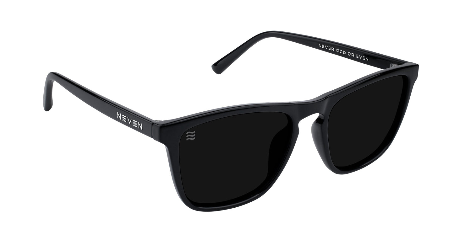 Nix by Neven Eyewear: Black rectangle sunglasses with thick frames and dark tinted UV400 lenses. “Neven” is printed in white on both arms, and “NEVER COECD CR EVEEY” is inside the right arm. Displayed on a white background.