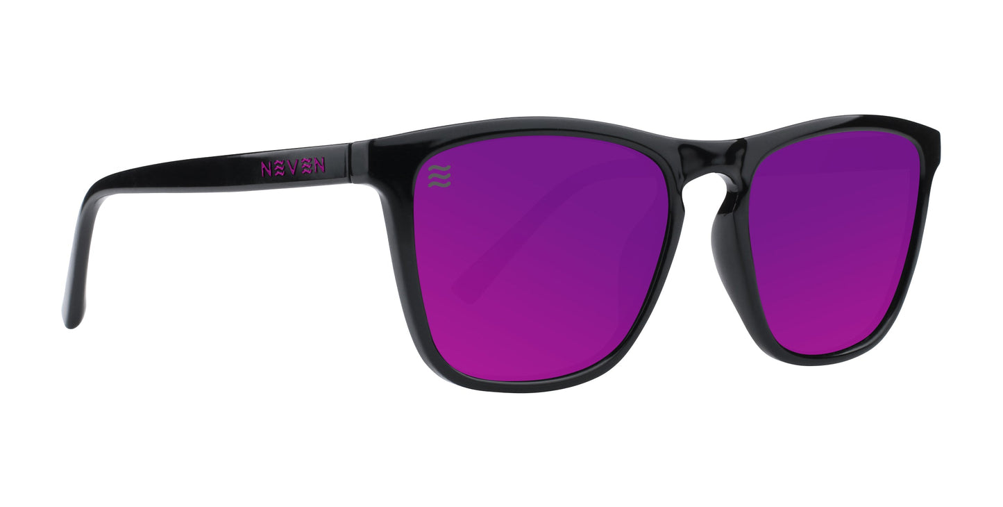 A pair of black-framed Neven Eyewear Violet sunglasses with vibrant violet-tinted lenses from the Cambridge collection. The left arm features "NIVEN" in purple by the hinge. Classic design, photographed on a plain white background.