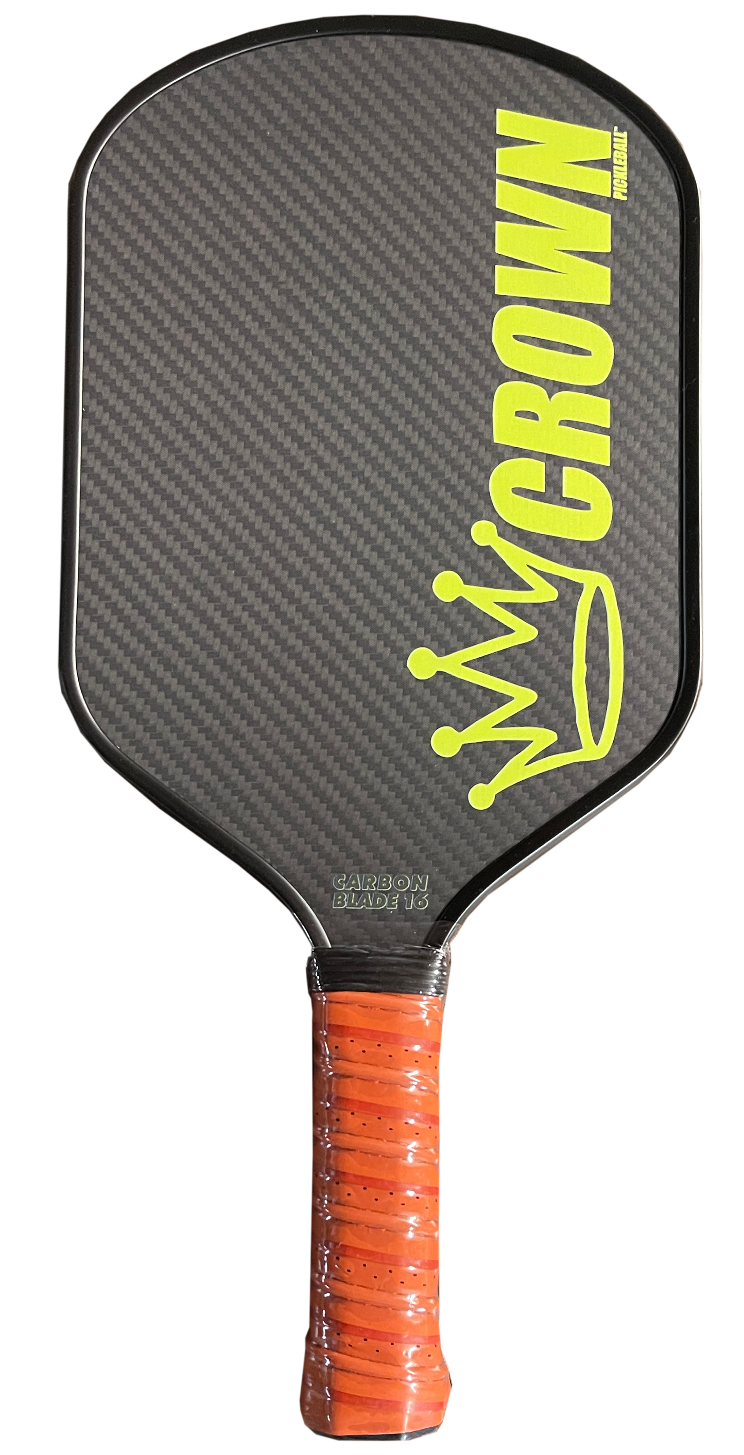 The Crown Pickleball Carbon Blade 16 (black paddle) features bold yellow "CROWN" text and a crown graphic on its carbon fiber face, plus an orange grip tape handle, displayed against a plain white background.