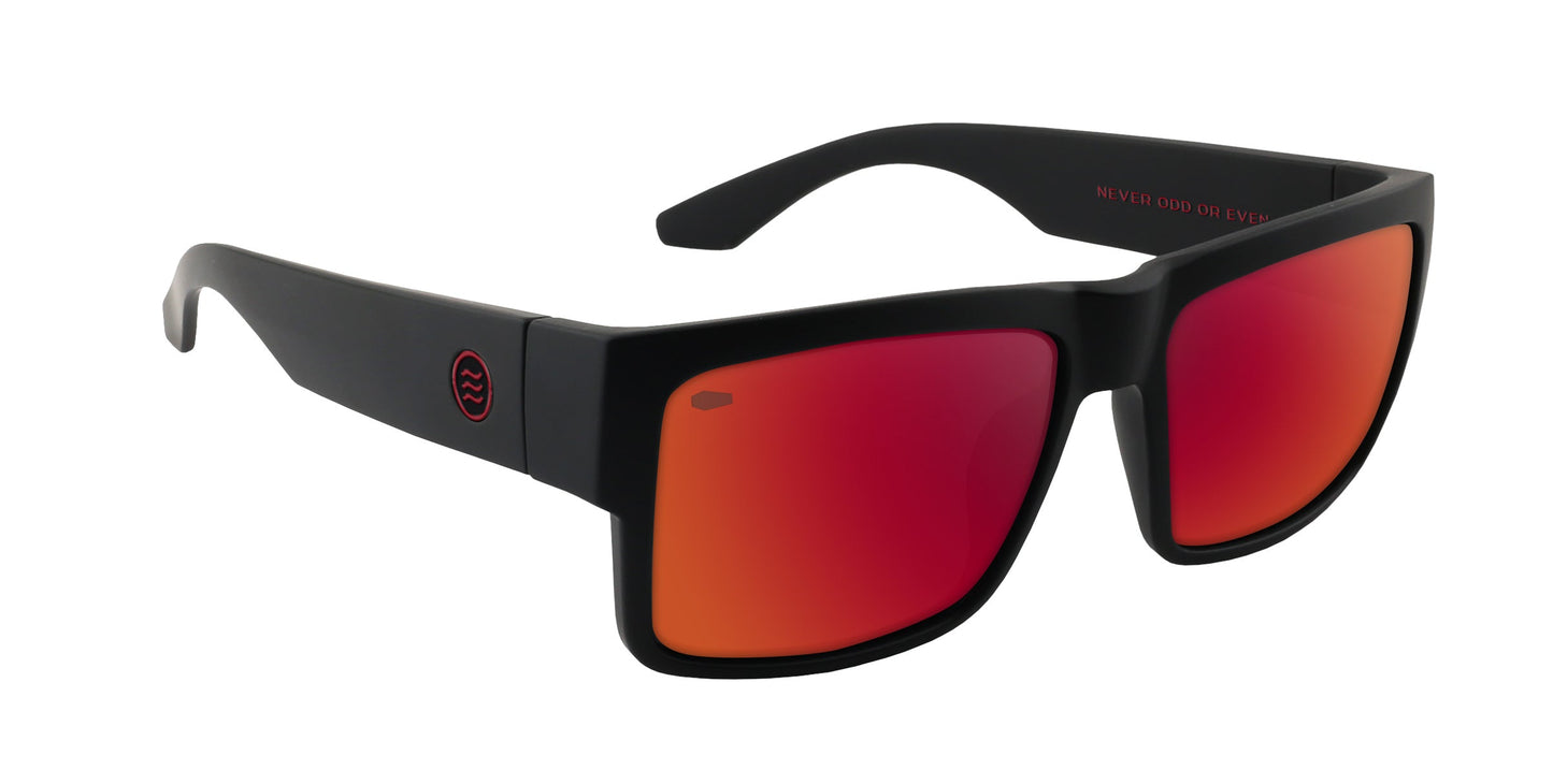 The Havoc sunglasses from Neven Eyewear feature a bold black rectangular frame with mirrored red-orange lenses, a wide arm accented by a small red circular wavy logo, and Tim Howley’s signature touch. Part of the Catacombs collection.