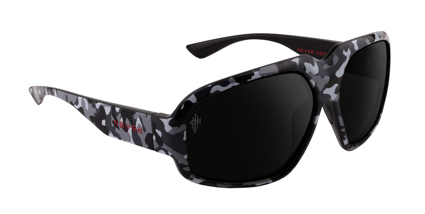 A.W.O.L. by Neven Eyewear: Camo sunglasses with large, rectangular black lenses and a black, white, and gray camo frame. “NEVER ODD” is printed in red inside the right arm and “NEVER” outside the left arm.