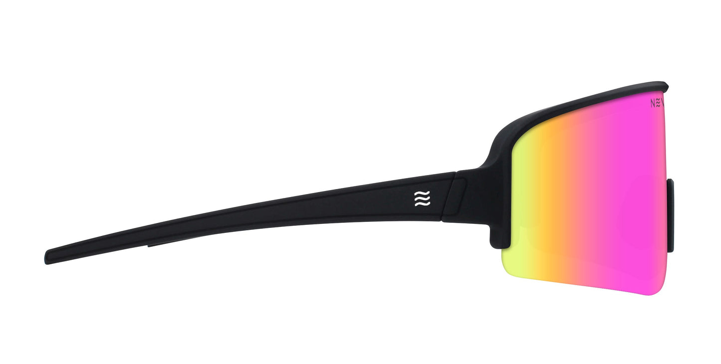Side view of sporty FLL SND sunglasses by Neven Eyewear, featuring a thick black frame, a single wraparound lens shifting yellow to pink and purple, and a wave logo near the hinge inspired by Joey Miuccio.