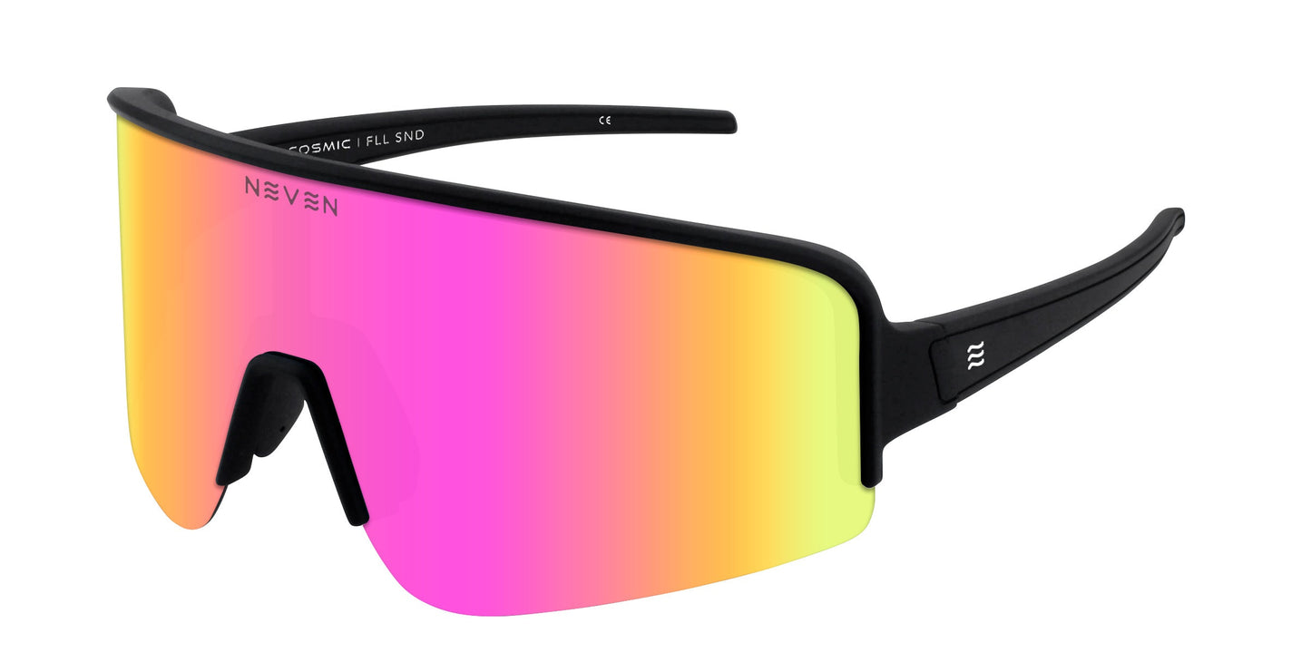 Neven Eyewear’s FLL SND sunglasses feature a single wraparound lens in a pink, orange, and yellow gradient with a black frame, thick arms with a white logo, and a sculpted nose bridge for comfort.
