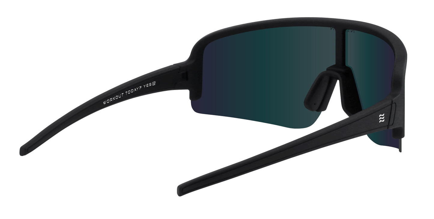 The Neven Eyewear FLL SND sunglasses feature a modern rimless design with a matte black frame, dark green-tinted wrap lenses, straight wide arms, raised nose pad, and Joey Miuccio’s logo on the left arm.