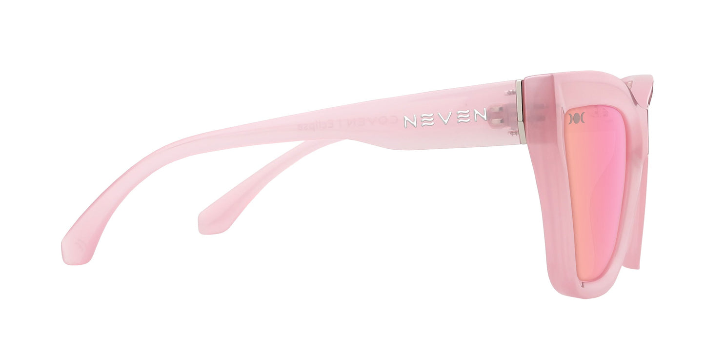 Side view of Eclipse cat-eye sunglasses by Neven Eyewear, featuring thick translucent pink frames and mirrored pink lenses. "NEVEN" is printed in white on the arm, set against a plain white background that highlights these stylish sunglasses.