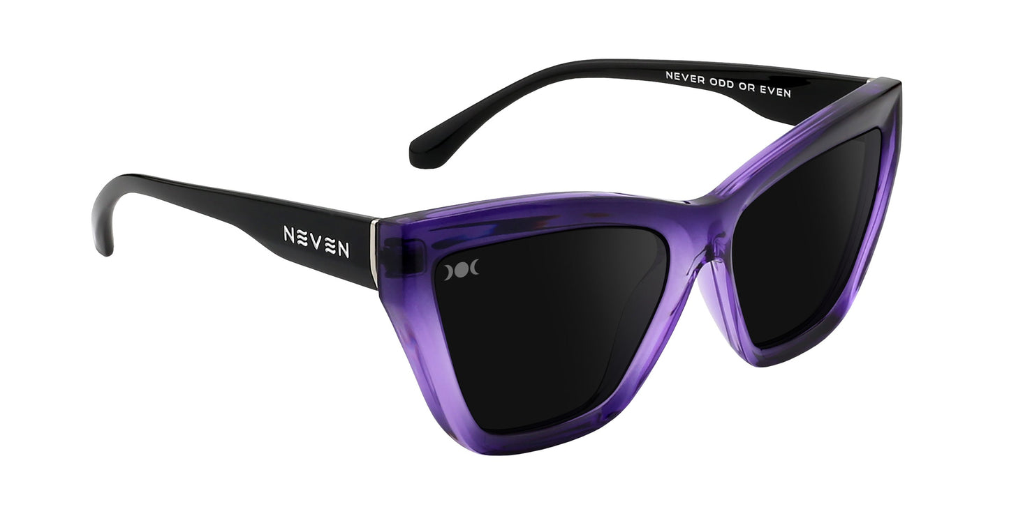 Ethereal by Neven Eyewear: cat-eye sunglasses with glossy, translucent purple frames, black arms, and dark polarized UV400 lenses. "NEVEN" is on the left arm, "NEVER ODD OR EVEN" on the right.
