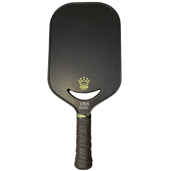 The CROWN PICKLEBALL - Carbon Blade 14 V3 (BLACK) by Crown Pickleball is a black, rounded rectangular advanced pickleball paddle with a textured grip and yellow crown logo near the base, plus "CROWN" and "USA" text, set on a plain white background.