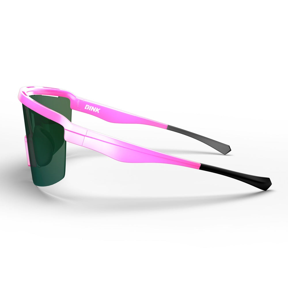 The Captiva Pickleball Sunglasses by Dink Eyewear feature a wraparound pink frame, black tips, and a green-tinted ColorBoost lens. "DINK" in white appears on the left arm. Performance sport eyewear is shown on a white background.