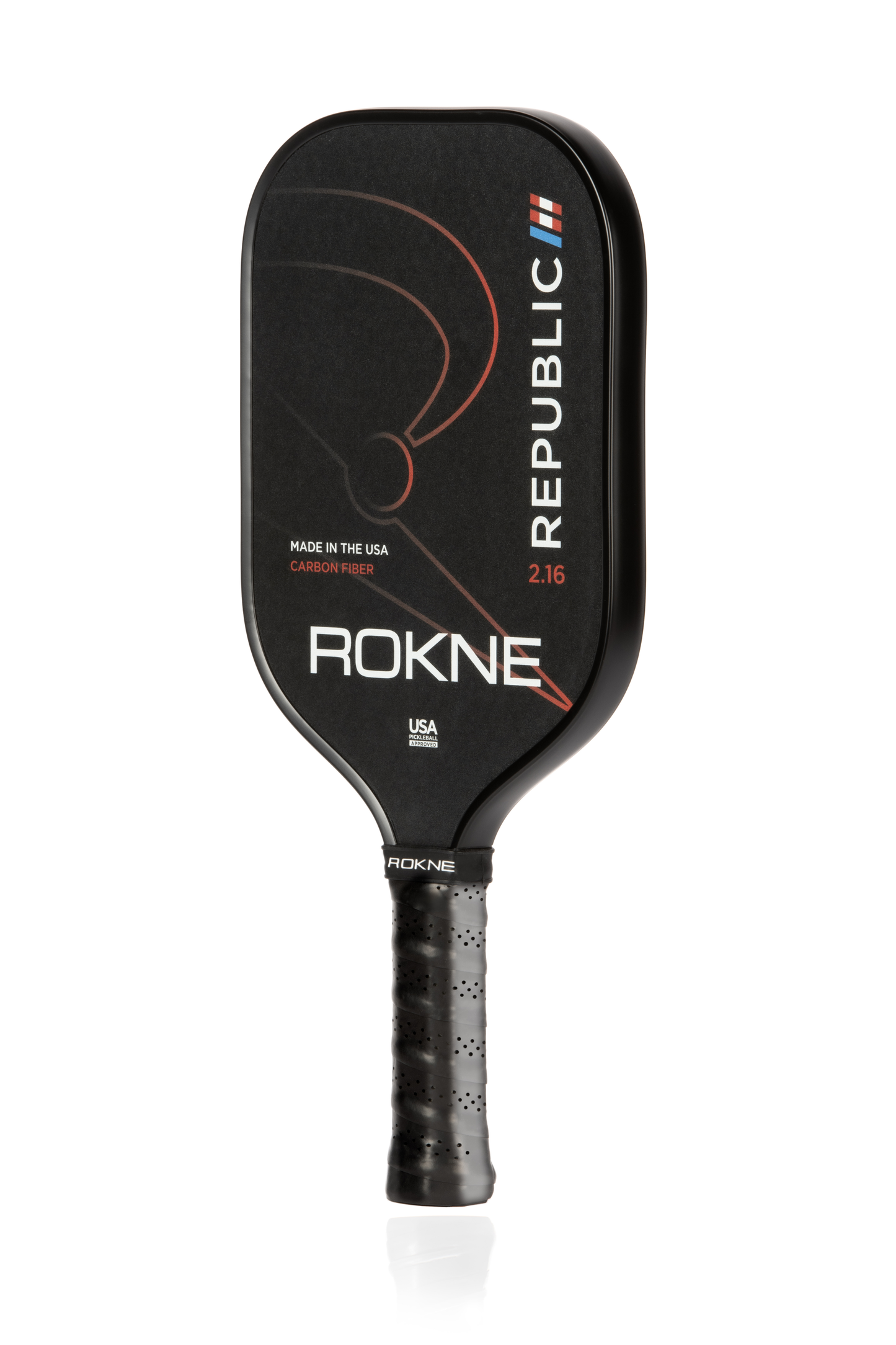 A black ROKNE REPUBLIC 2.16 UNIDIRECTIONAL CARBON FIBER pickleball paddle with a textured grip, POSIcore construction, curved white/orange lines, "REPUBLIC" in white vertically right, and MADE IN THE USA plus ROKNE on the face.