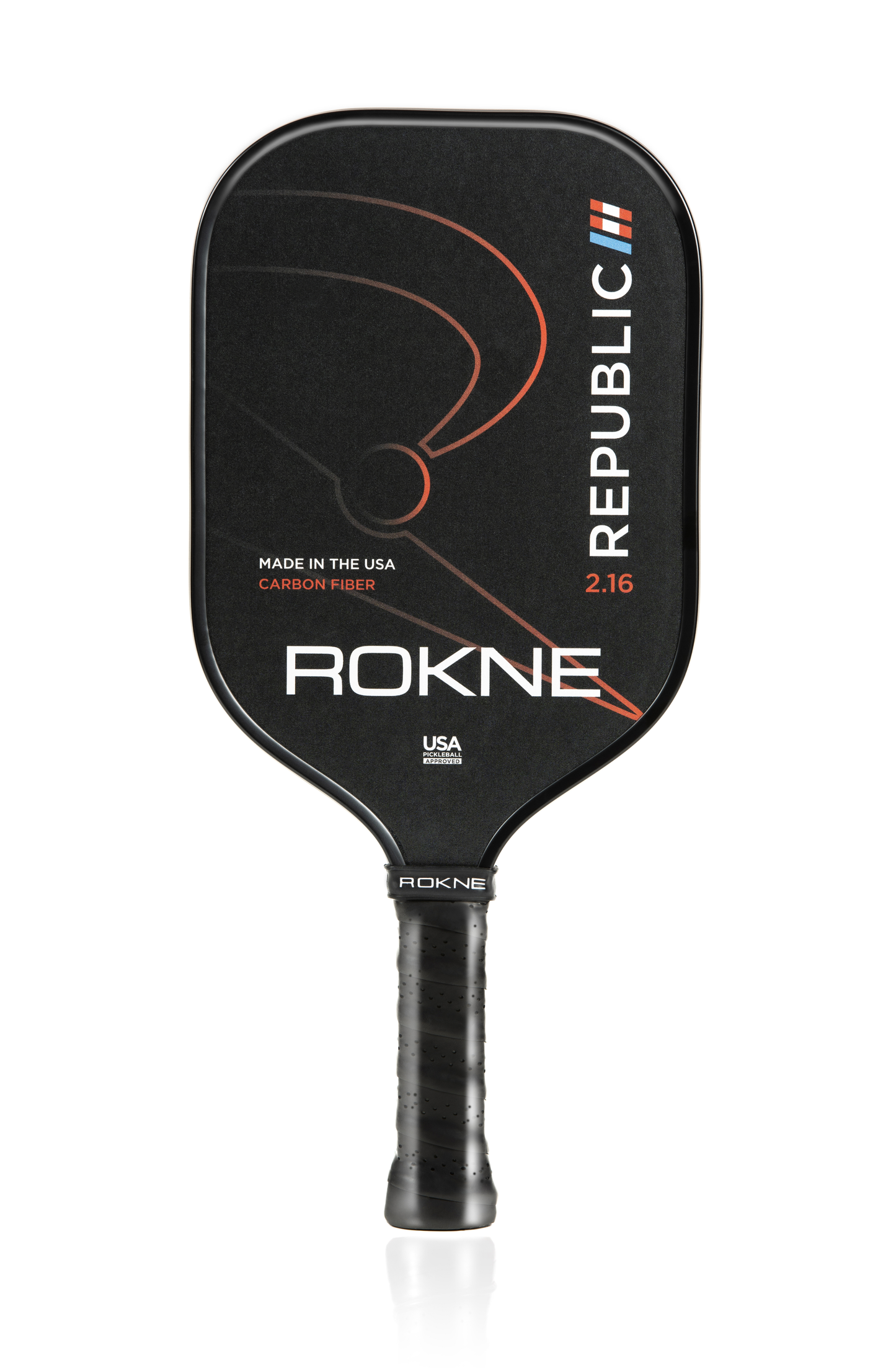 The black ROKNE REPUBLIC 2.16 Unidirectional Carbon Fiber pickleball paddle features POSIcore construction, a textured face, curved orange lines, "REPUBLIC" in bold white with three colored stripes, and a handle wrapped in black grip tape.
