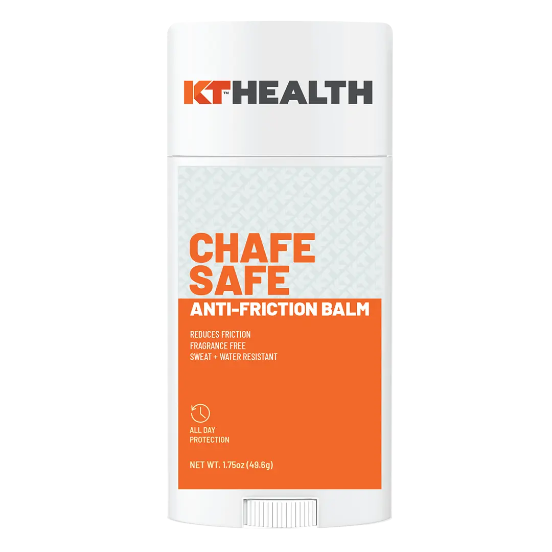 A white stick container labeled KT Tape features KT Health Chafe Safe™ Anti-Friction Balm with orange text, offering chafing protection, blister prevention, fragrance free, sweat & water resistance; net wt. 1.75 oz (49.6g).