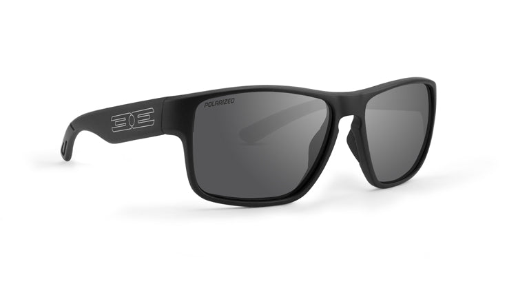 The Charlie Polarized Sunglasses by Epoch Eyewear feature a matte black frame, dark polarized lenses with "POLARIZED" on the left lens, and white geometric logo arms. Sporty and modern, they're ideal for any adventure.